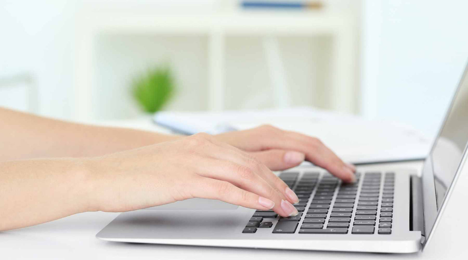 Person typing on computer