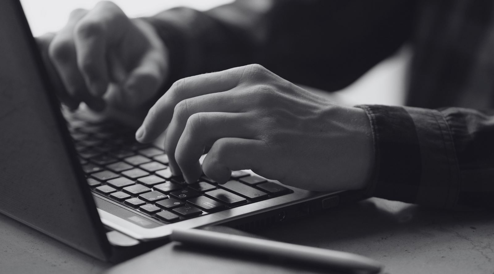 Person typing on laptop